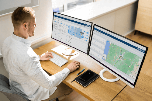 A fleet manager looking at his fleets truck scale readings A fleet manager looking at his fleets truck scale readings