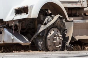 A truck with a blown tire